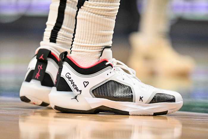 View of Bradley Beal's white, black, and red Air Jordan shoes.